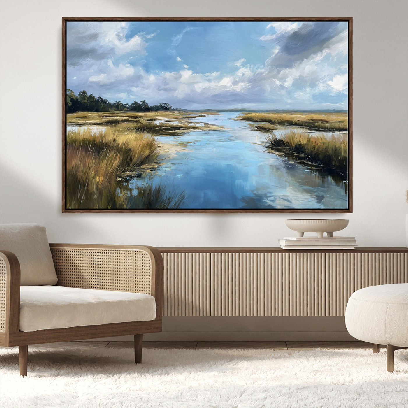 A beautiful, painterly landscape of a calm river winding through a marsh, with vibrant green grasses and a bright blue sky filled with fluffy clouds.