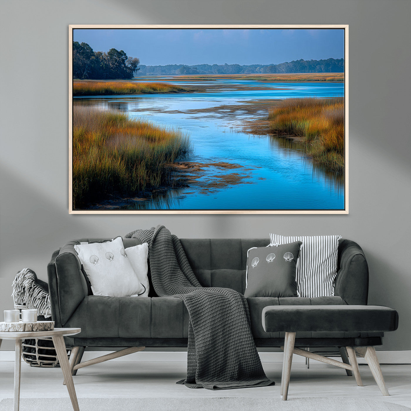 A peaceful marshland scene with calm blue water reflecting the surrounding grasses and trees, capturing the beauty of nature in a serene landscape.