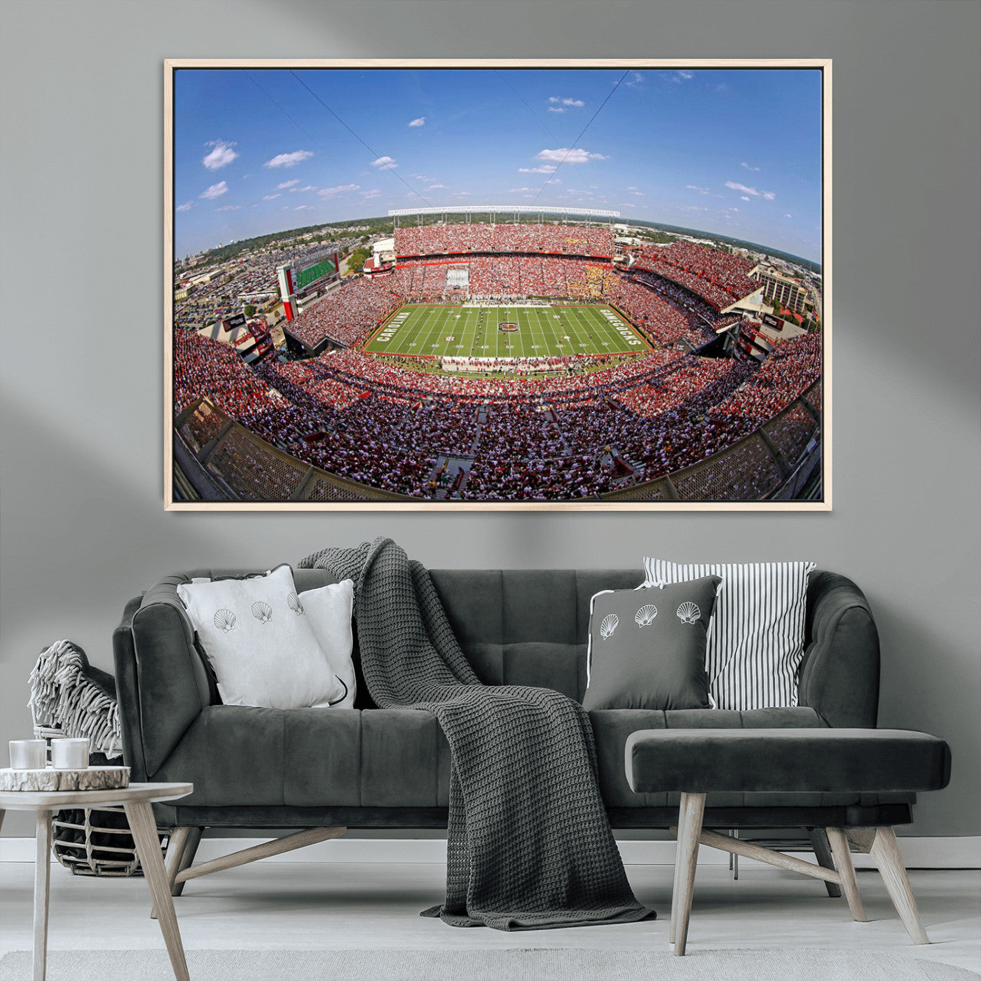 An William Brice-Stadium view of a full football stadium with cheering fans and clear blue skies, capturing the excitement and energy of the game.