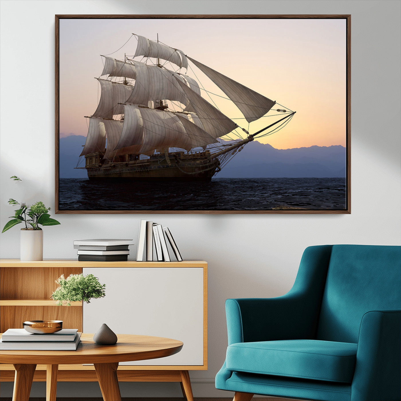 Majestic tall ship with full sails gliding across the ocean at sunset, with mountain silhouettes in the background – Wall Art Canvas Print.