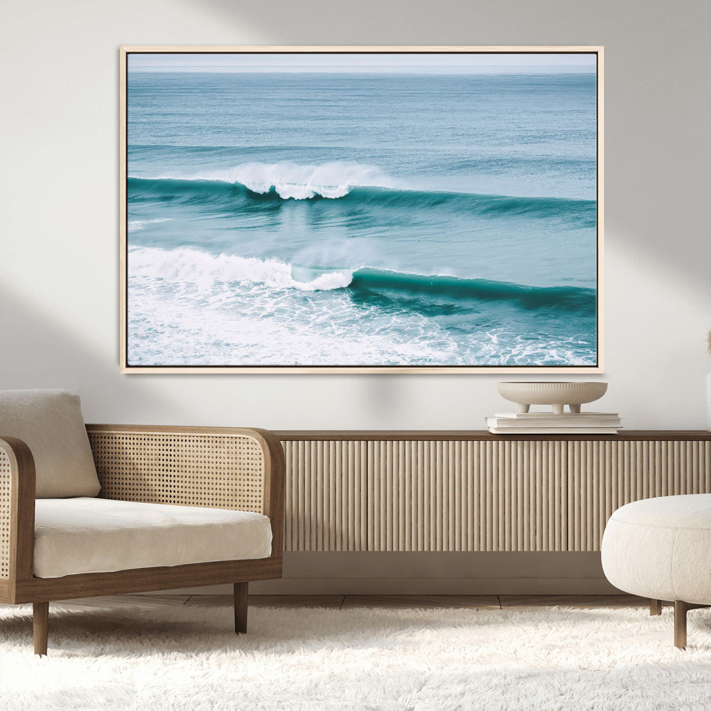 Powerful ocean waves rolling towards the shore, their turquoise hues blending with white sea foam under an open horizon, capturing the essence of the ocean's movement.