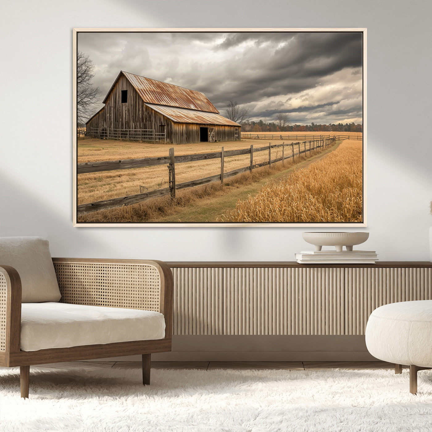 "Rustic barn with a weathered metal roof, surrounded by a wooden fence and golden fields under an overcast sky with dramatic clouds."