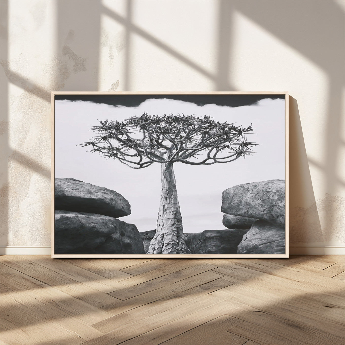 Black and white Joshua tree with bold rocky background, ideal for minimalist or desert-inspired home wall decoration.