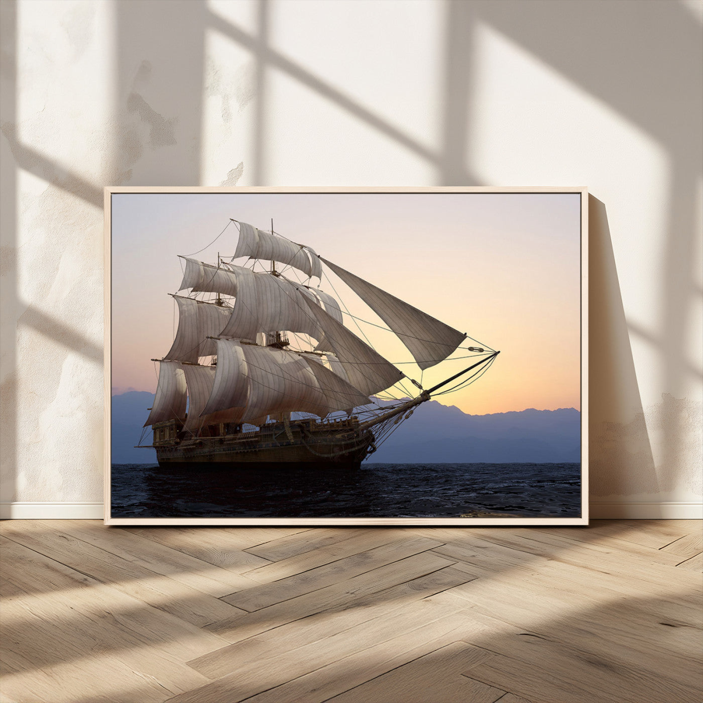 Majestic tall ship with full sails gliding across the ocean at sunset, with mountain silhouettes in the background – Wall Art Canvas Print.