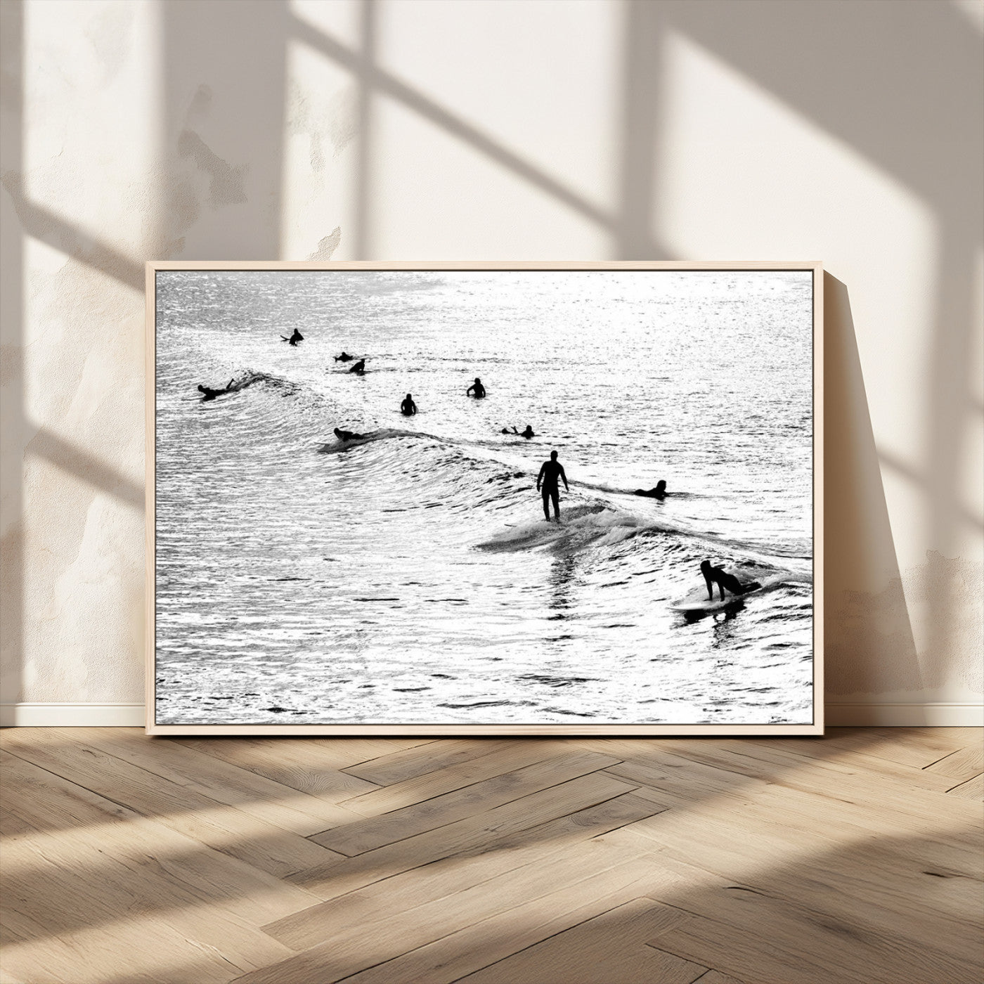 19970637-MGV-CV-36X24-Black and white artistic view of surfers riding and paddling on waves in the ocean, capturing the dynamic motion and energy of surfing