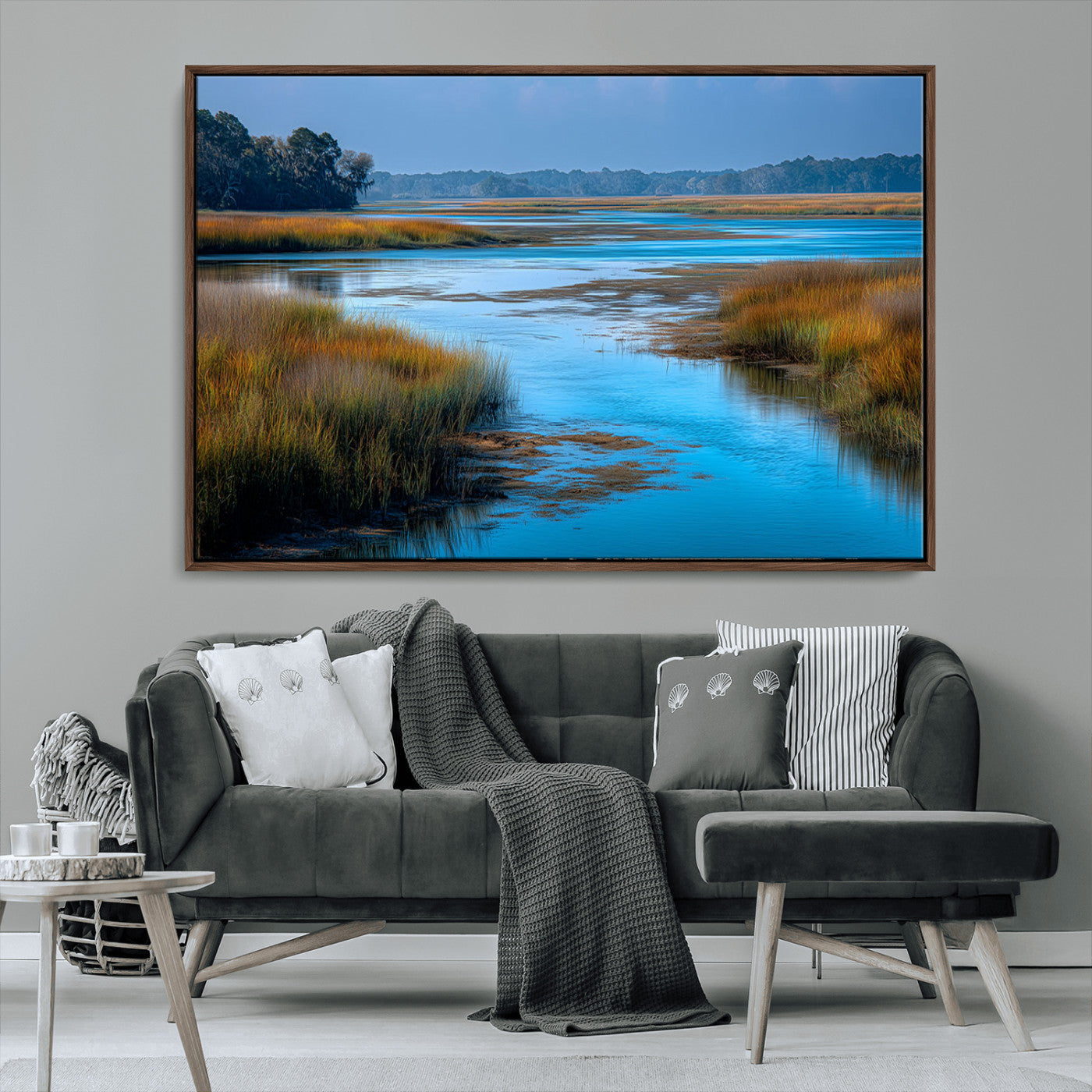 A peaceful marshland scene with calm blue water reflecting the surrounding grasses and trees, capturing the beauty of nature in a serene landscape.