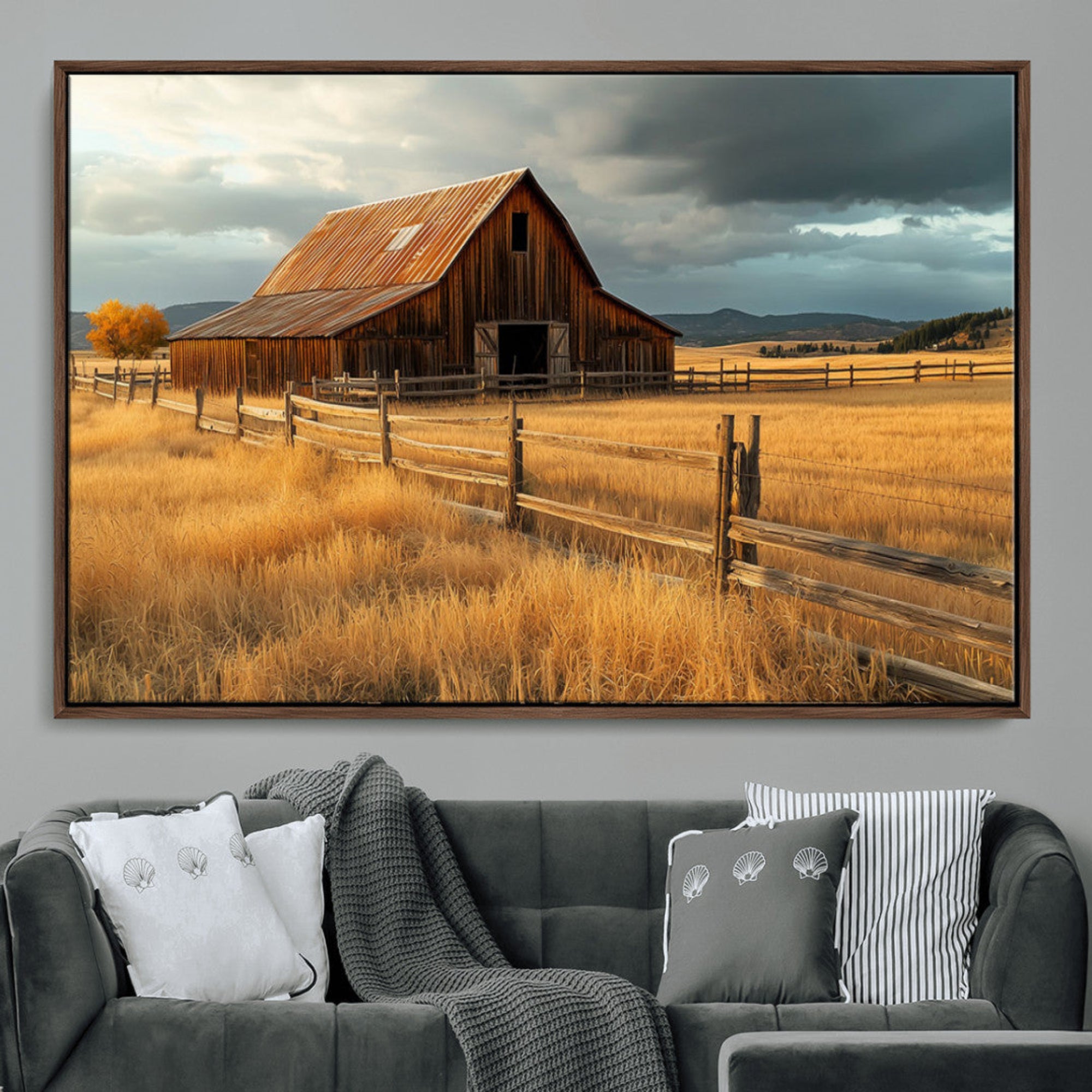 "Golden fields surrounding a rustic barn with a weathered roof, a wooden fence, and dramatic skies with sunlight breaking through the clouds."