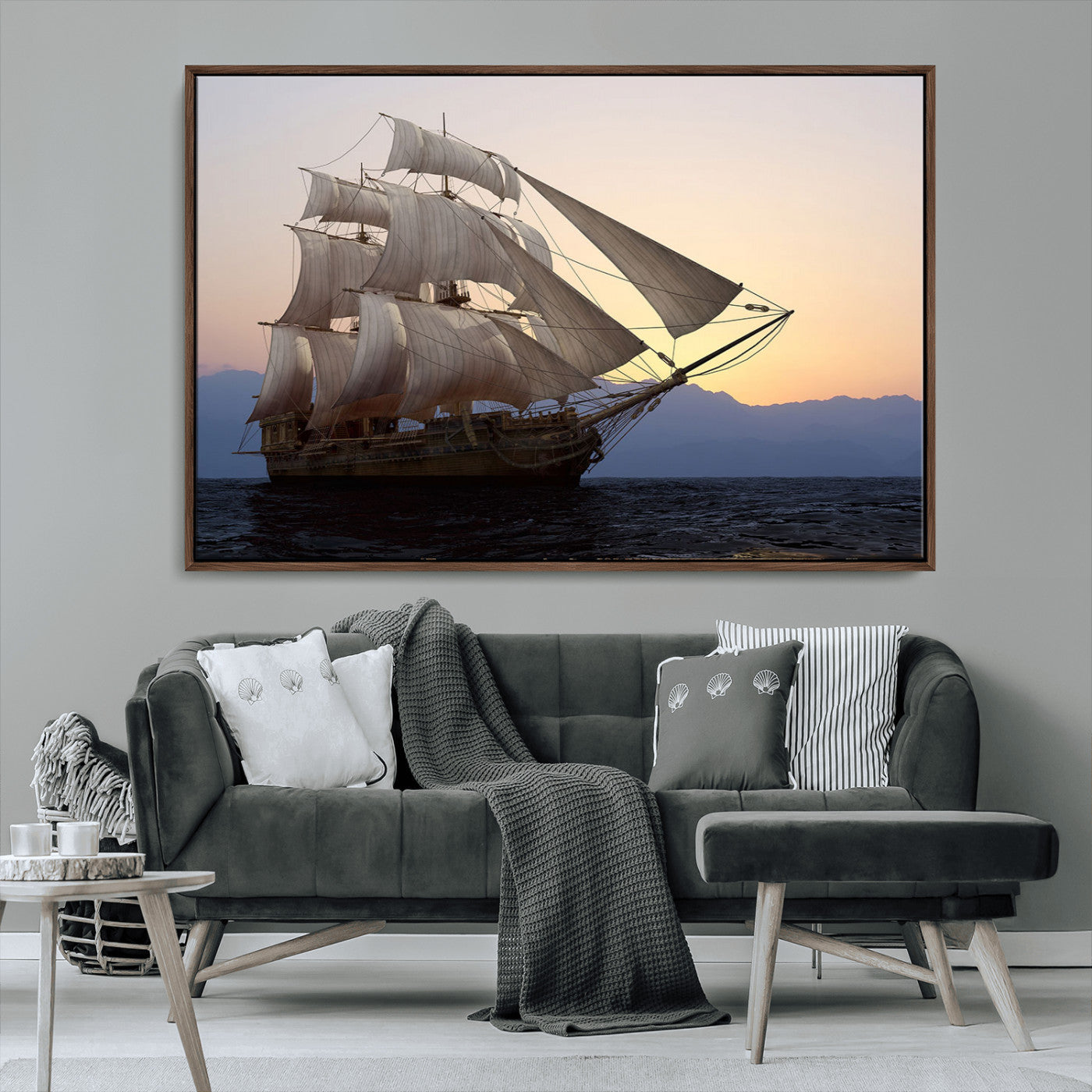 Majestic tall ship with full sails gliding across the ocean at sunset, with mountain silhouettes in the background – Wall Art Canvas Print.