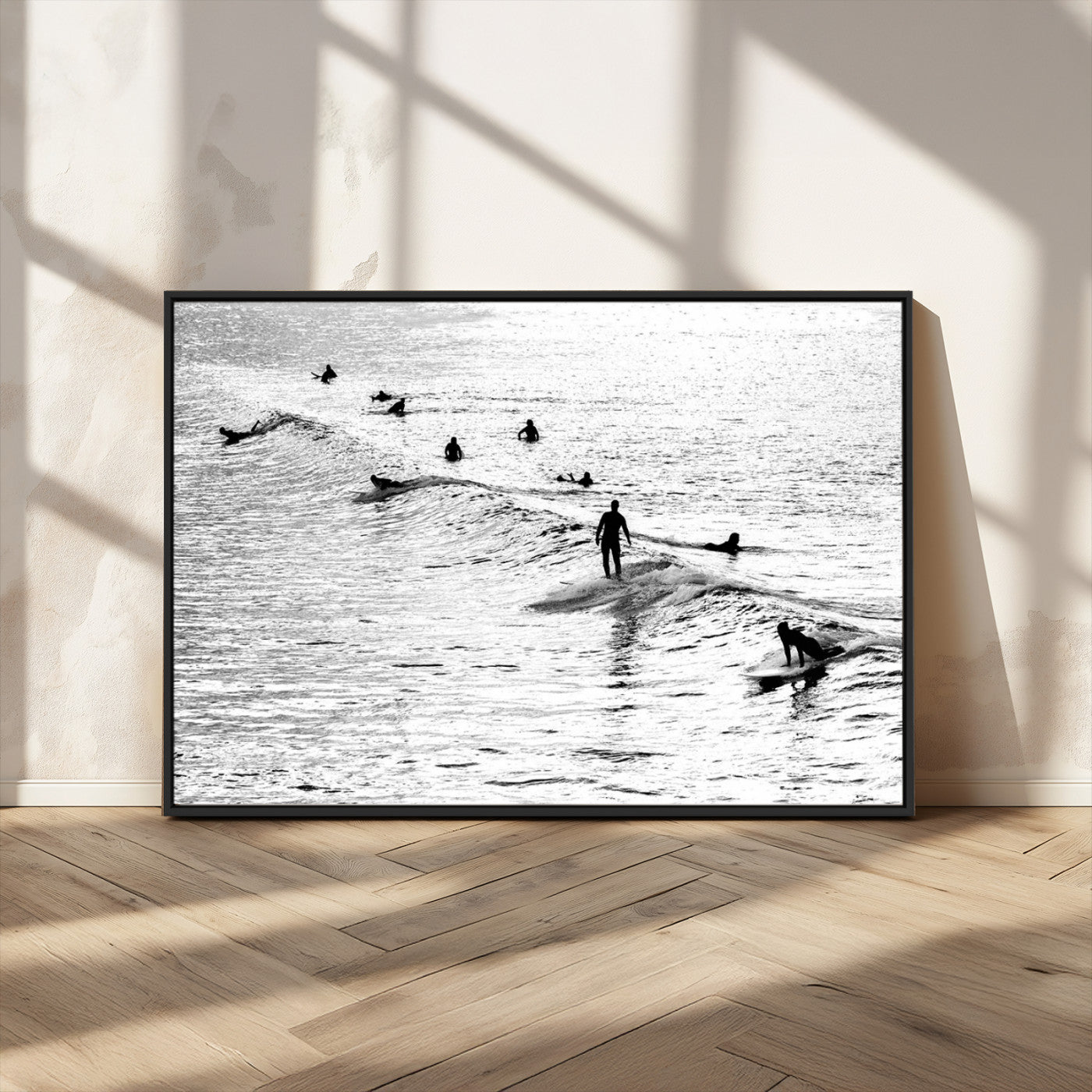 19970637-MGV-FC-36X24_Black-Black and white artistic view of surfers riding and paddling on waves in the ocean, capturing the dynamic motion and energy of surfing