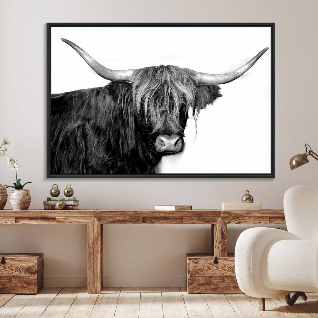 The Black and White Highland Cow Multi Panel Wall Art Canvas Print with UV-protection hangs prominently.