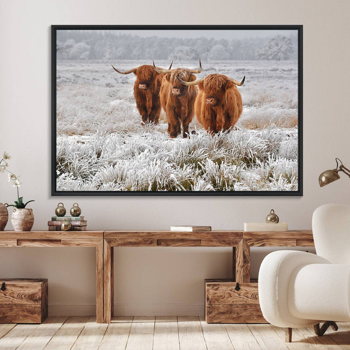 The Highland Cows in Snow canvas showcases three cattle in a frosty field.