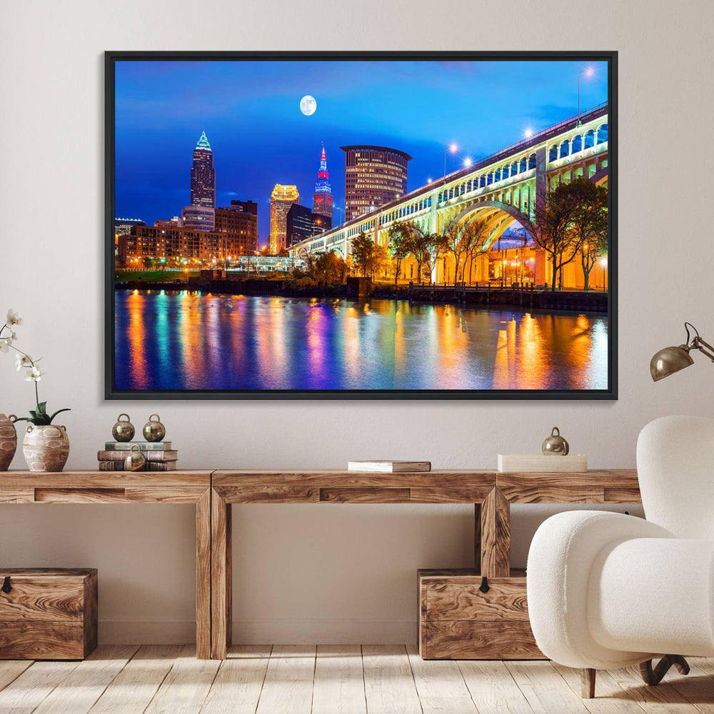 A Cleveland Night Skyline Wall Art on museum-quality canvas showcases a bridge and illuminated buildings.