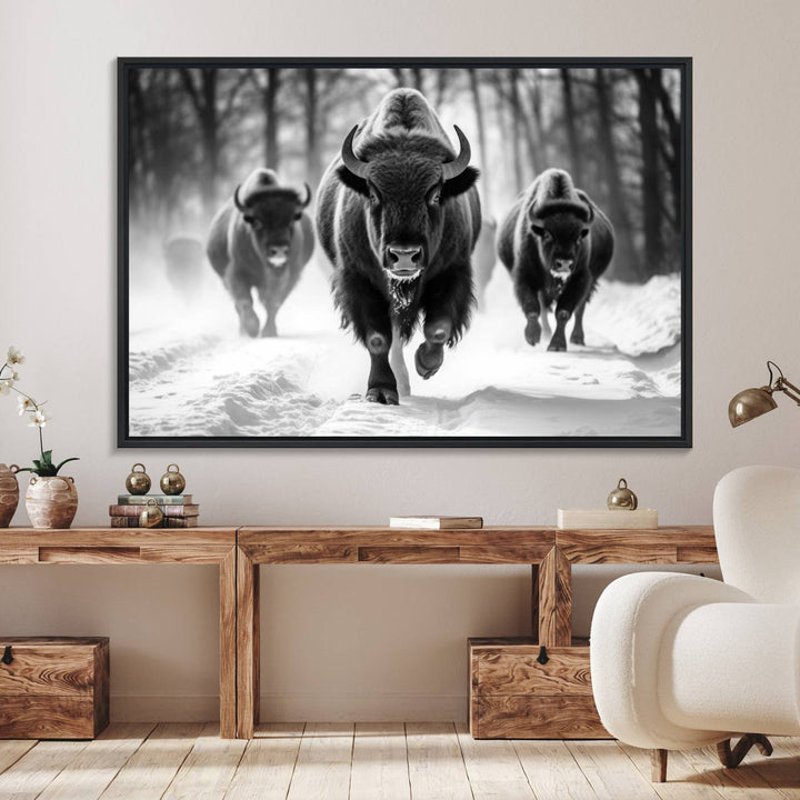 The Buffalo Wall Art Canvas Print of bison running through snow adorns the wall.