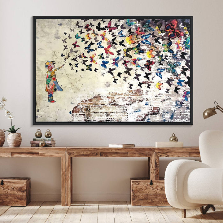 A Banksy Girl Butterfly Canvas Print is displayed on the textured wall.