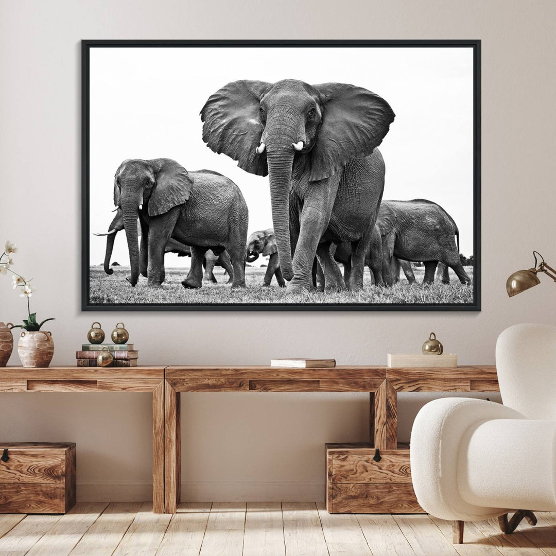 A modern dining area features a Black White Elephant Family Wall Art Canvas Print.