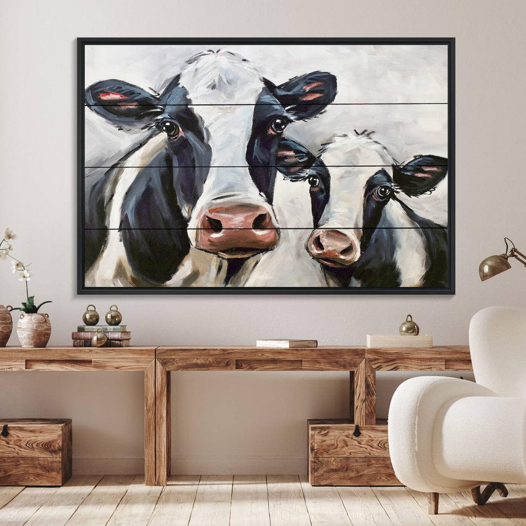 The Vintage Baby and Mom Cattle Canvas, featuring cows with black and white patches, is a prominent piece of wall art.