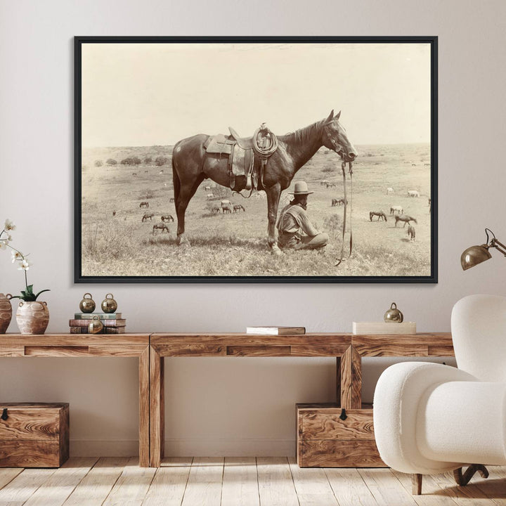 Cowboy Wall Art - Vintage Western Horse Canvas Print features a cowboy kneeling by his horse in a field.