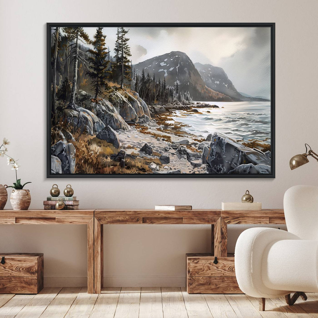 Framed wall art depicting Acadia National Parks rocky coast, trees, mountains, and sunlight over the sea; ready to hang.