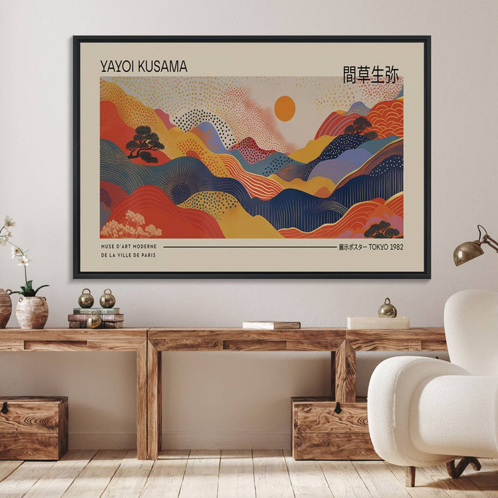 The Yayoi Kusama vibrant landscape canvas print featuring abstract mountains and a sun enhances the space with its modern aesthetic.