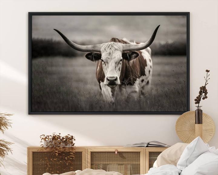 The Texas Longhorn Cow Canvas Wall Art Print adds a rustic touch to a living room.