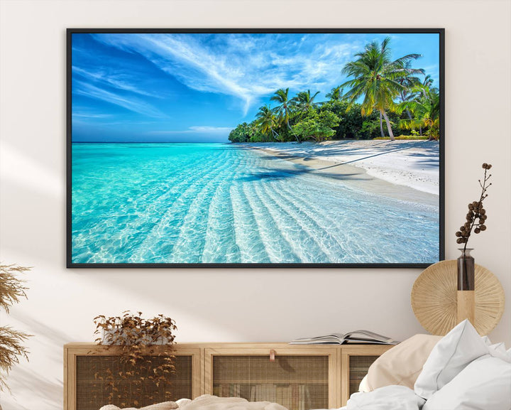 The Tropical Beach Wall Art Canvas Print showcases a serene ocean landscape with crystal clear turquoise water and palm trees, beautifully enhancing the coastal decor.