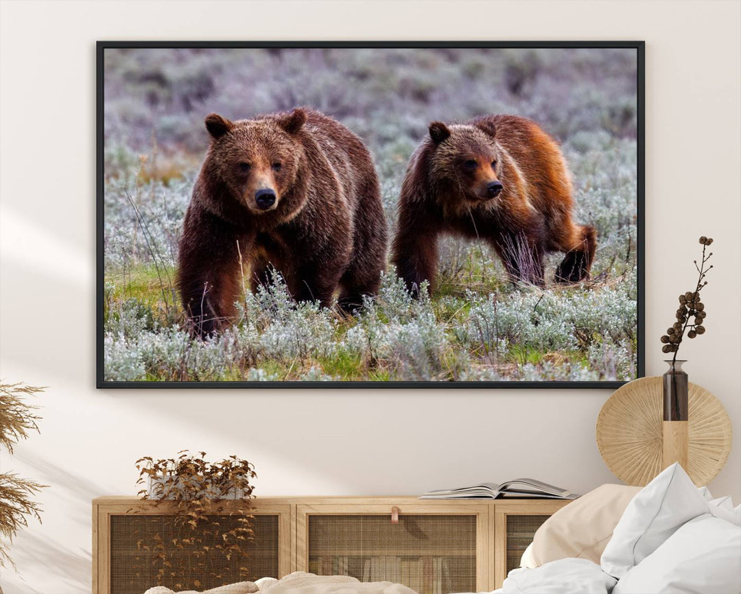 The "Queen of the Tetons" is a stunning canvas art print featuring Grizzly 399 and two bears strolling through a grassy field. Its gallery-quality finish beautifully captures the essence of nature, making it perfect for rustic home decor.