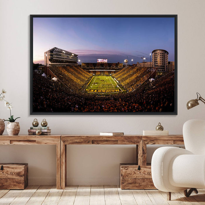 The Iowa Hawkeyes Kinnick Stadium Wall Art Canvas Print captures a sunset scene, making it perfect for display on a wall.