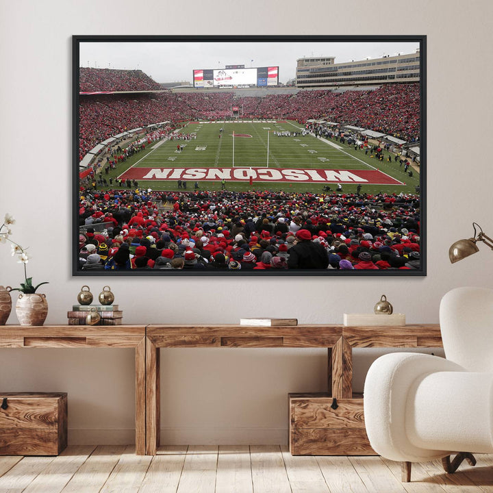 The wall art depicts WISCONSIN in red and white, similar to Wisconsin Badgers Football Canvas Art.