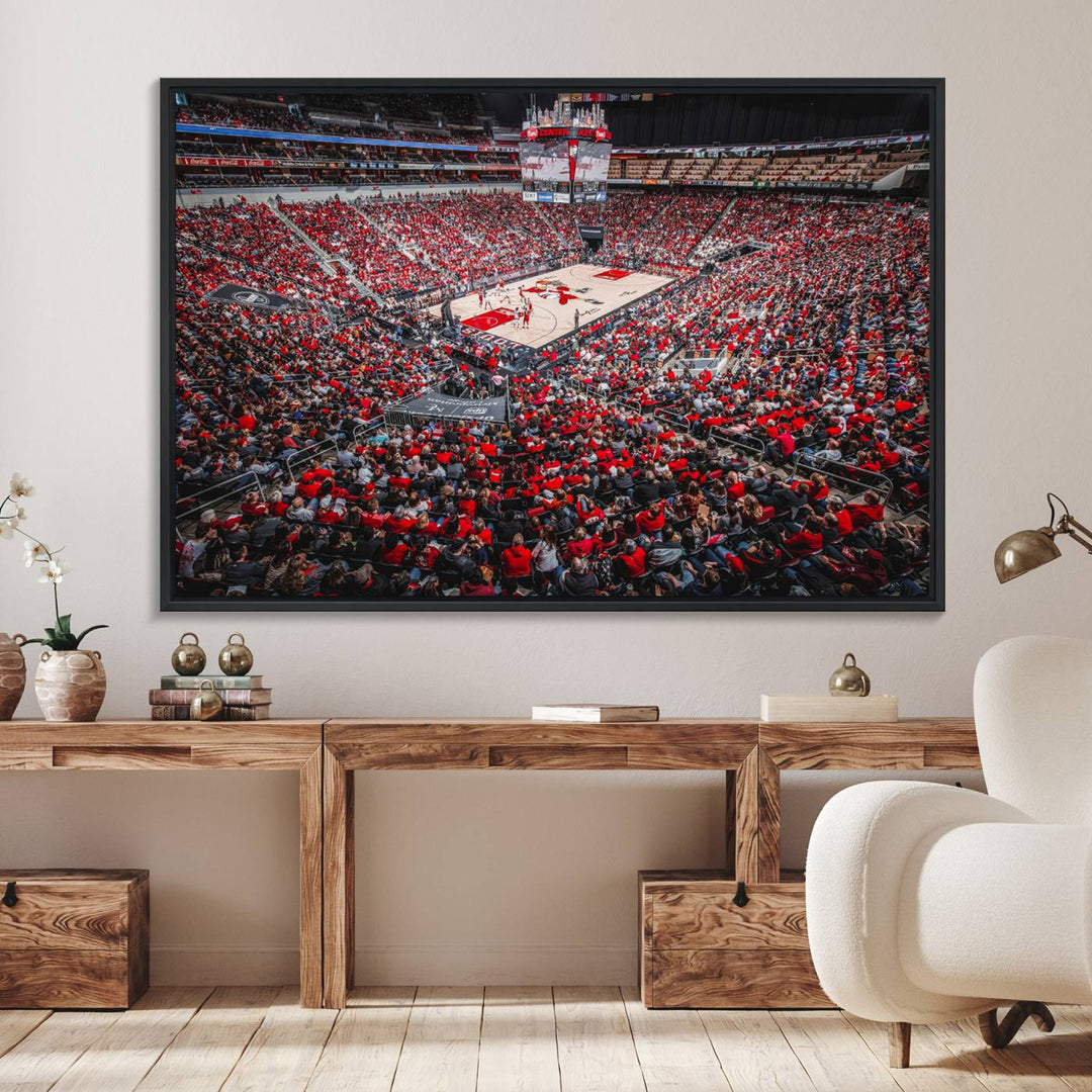 A painting of Louisville Cardinals fans in red at the KFC Yum Center Arena.