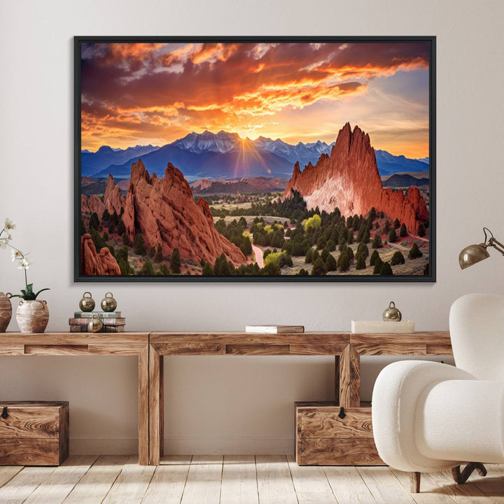 A vibrant sunset over the Rocky Mountains with red rocks.