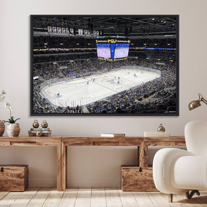 A large Enterprise Center canvas of a crowded hockey arena hangs prominently.