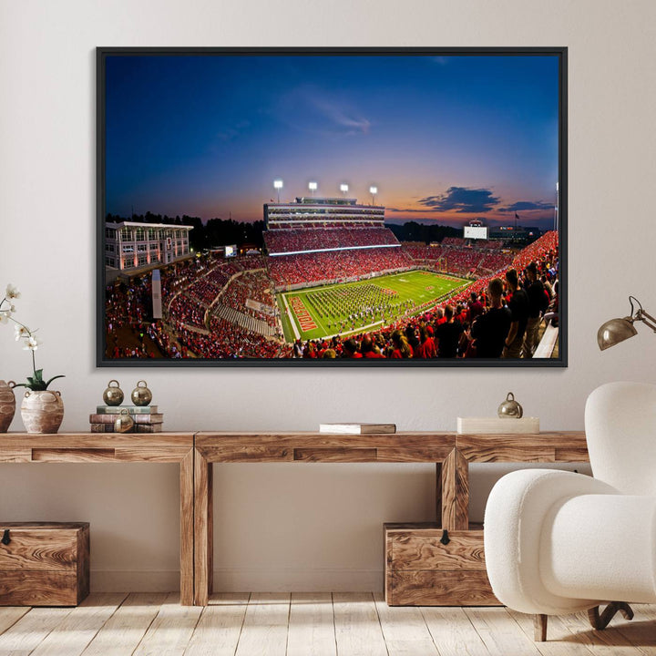 A vibrant and dynamic painting captures the essence of an electrifying night game at Carter-Finley Stadium, highlighting the illuminated atmosphere as the NC State Wolfpack competes under bright stadium lights.