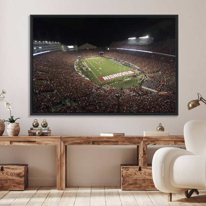 A painting of a stadium packed for a Wisconsin Badgers game, with WISCONSIN clearly visible in the end zone at Camp Randall Stadium.