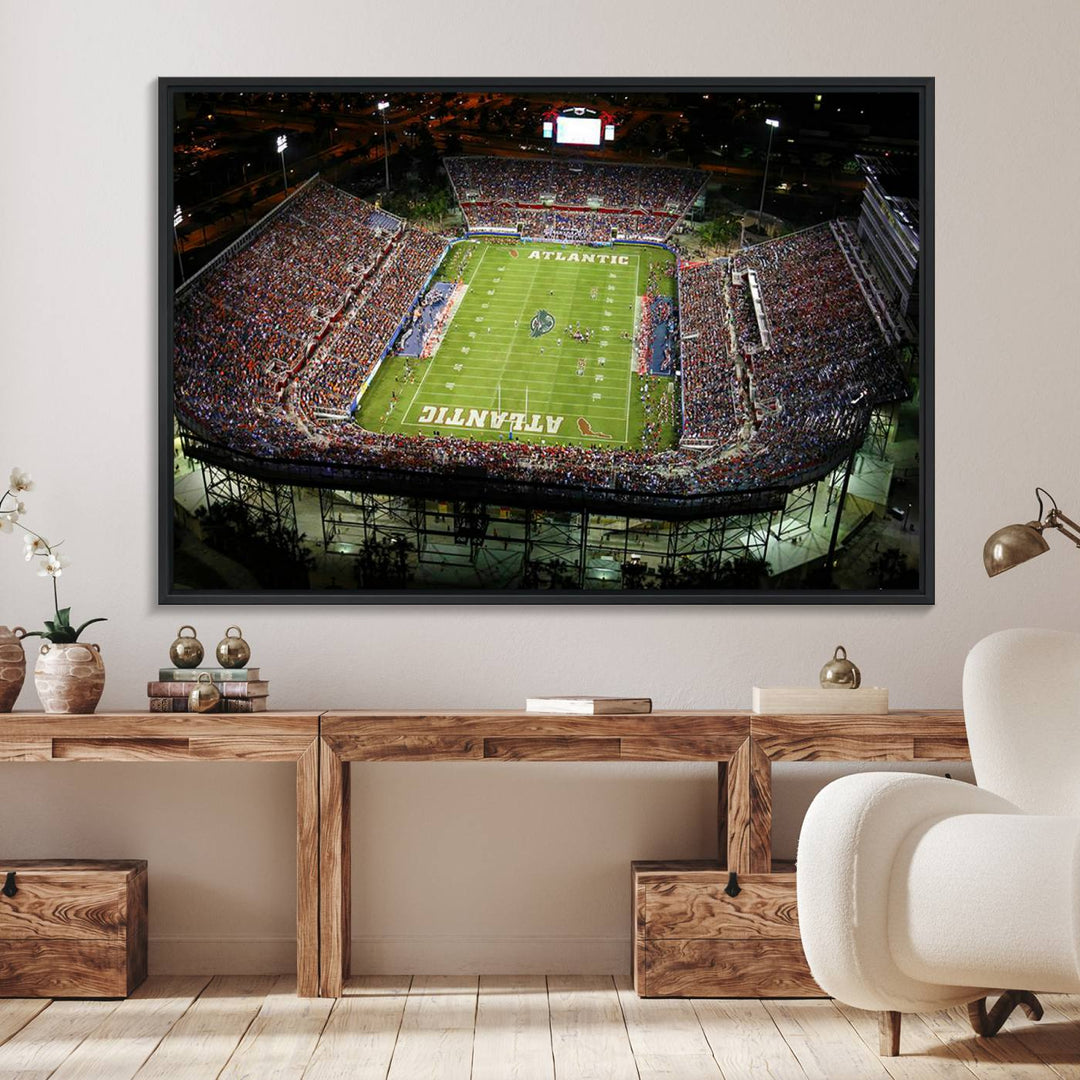 Gallery-quality wall art complements the view of the FAU Stadium with Florida Atlantic University Owls on the field in a night aerial setting.