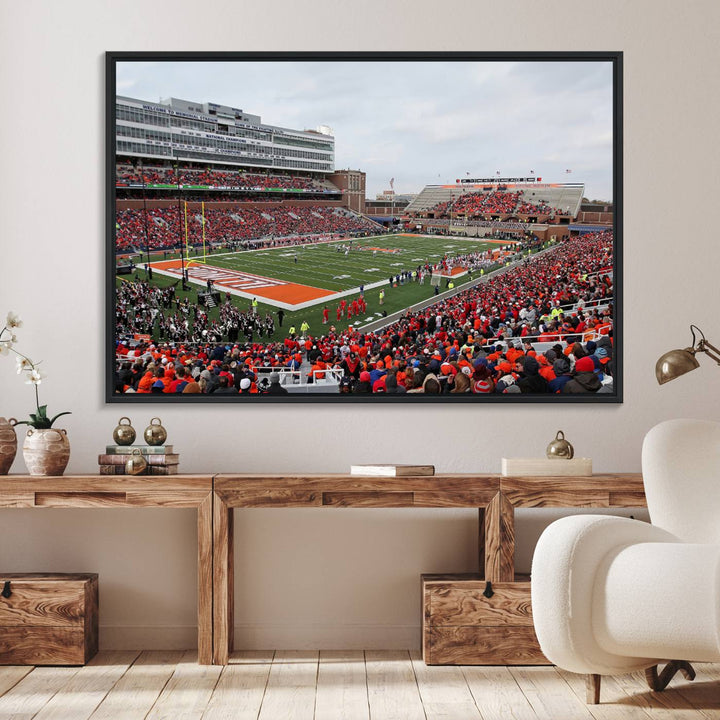 A University of Illinois Fighting Illini wall art canvas hangs on the wall, depicting a packed stadium.