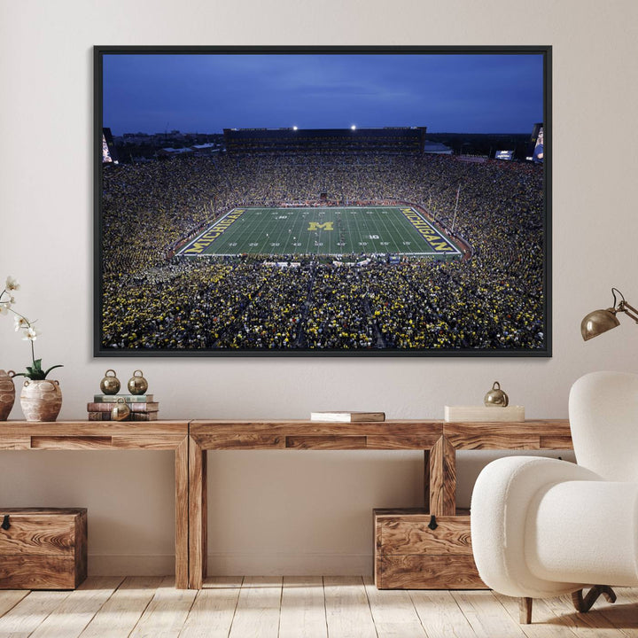 Wall art featuring an aerial shot of Michigan Stadium at dusk, showcasing the University of Michigan Wolverines M logo.