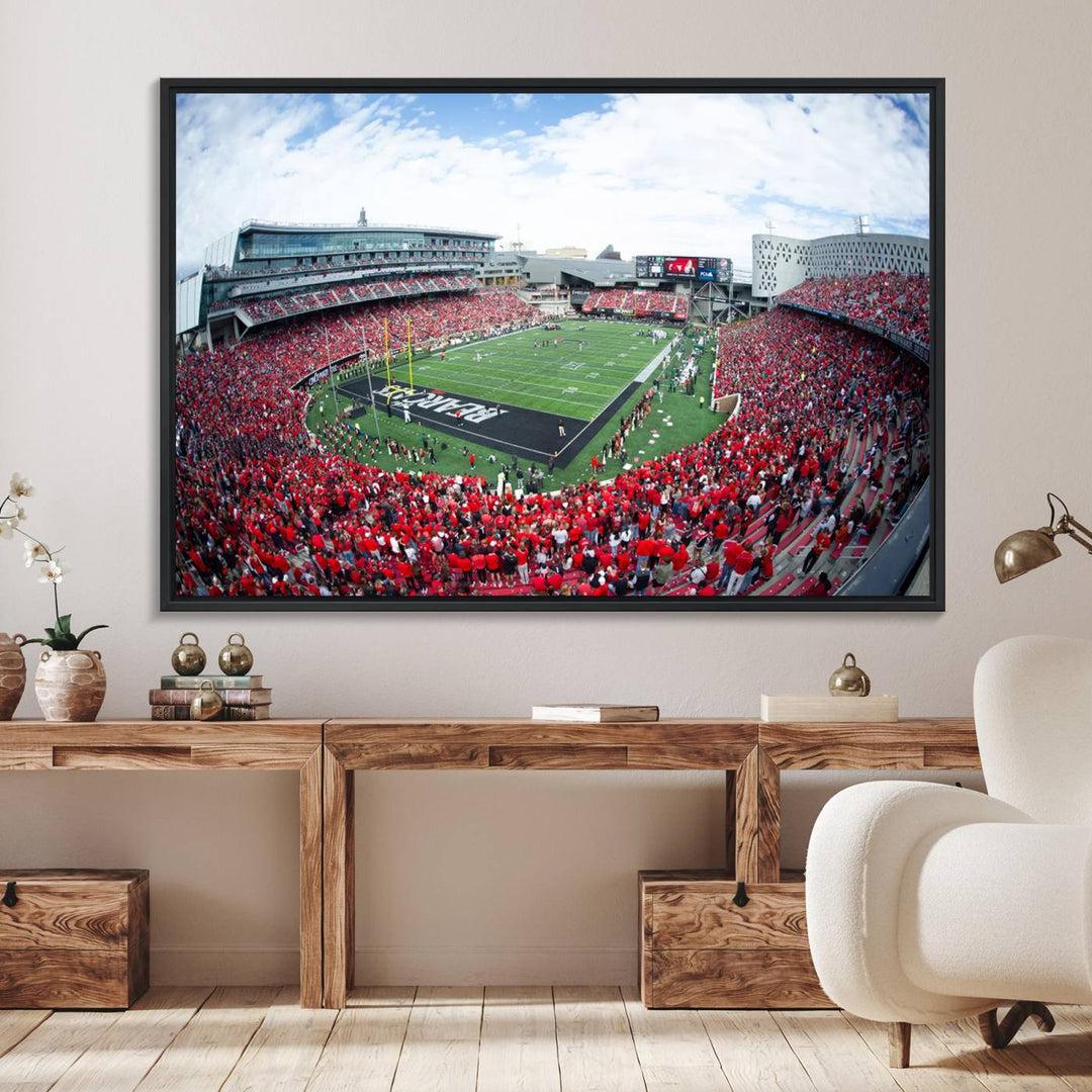 The wall showcases a Nippert Stadium canvas print of the Cincinnati Bearcats.