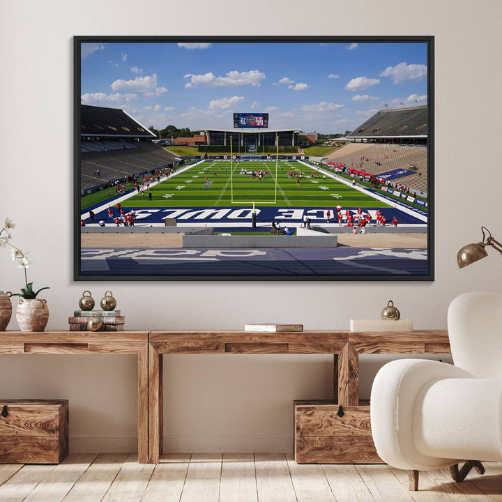 Rice Stadium print: This artwork features a football field with empty stands and a gallery-quality finish under a clear blue sky.