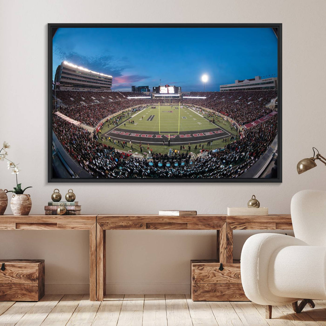 The wall art in the living room features a Texas Tech Red Raiders Football Team Print, showcasing Jones AT&T Stadium at dusk.