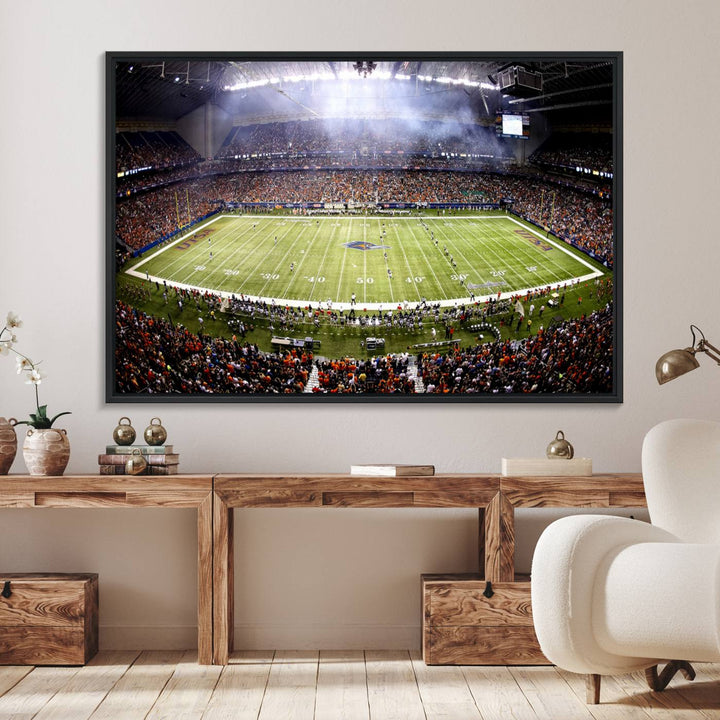 The modern living room features an Alamodome wall art canvas print, depicting a stadium filled with spectators for a UTSA Roadrunners game.