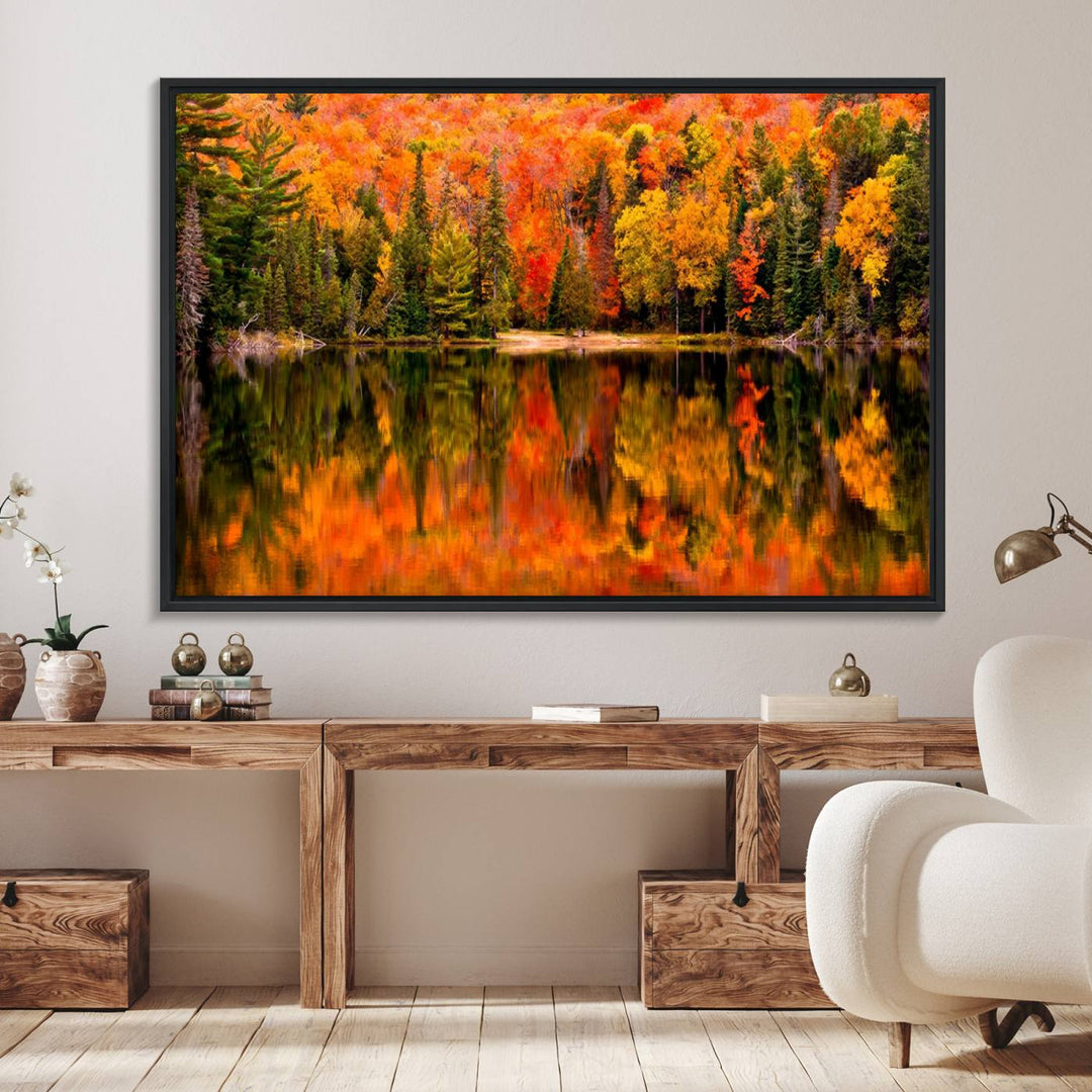 Autumn Forest Reflection Wall Art: a vibrant triptych canvas featuring fall foliage with red, orange, and yellow leaves over a calm lake.