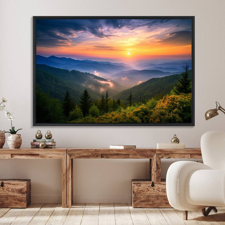 The Majestic Mountain Sunrise Print features a vibrant sky, layered hills, and evergreens, making it a stunning piece of wall decor.