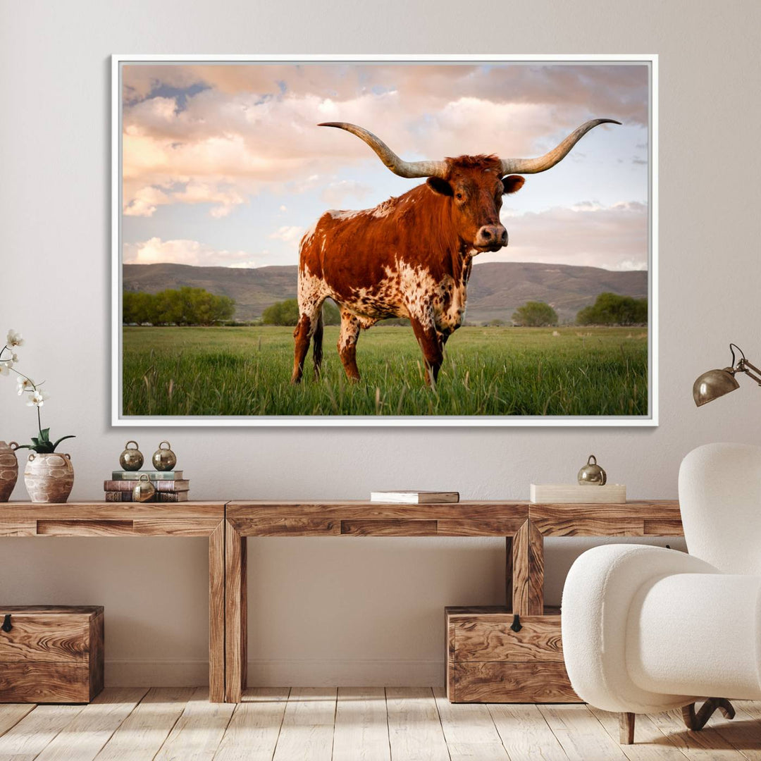 The Texas Cow Canvas Wall Art print captures a longhorn cow at sunset and is ready to hang.