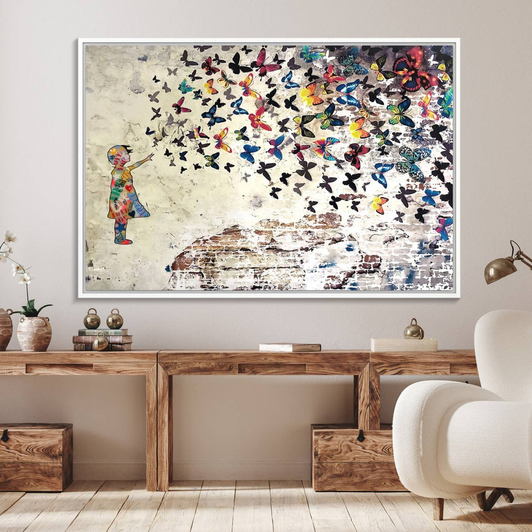 A Banksy Girl Butterfly Canvas Print is displayed on the textured wall.