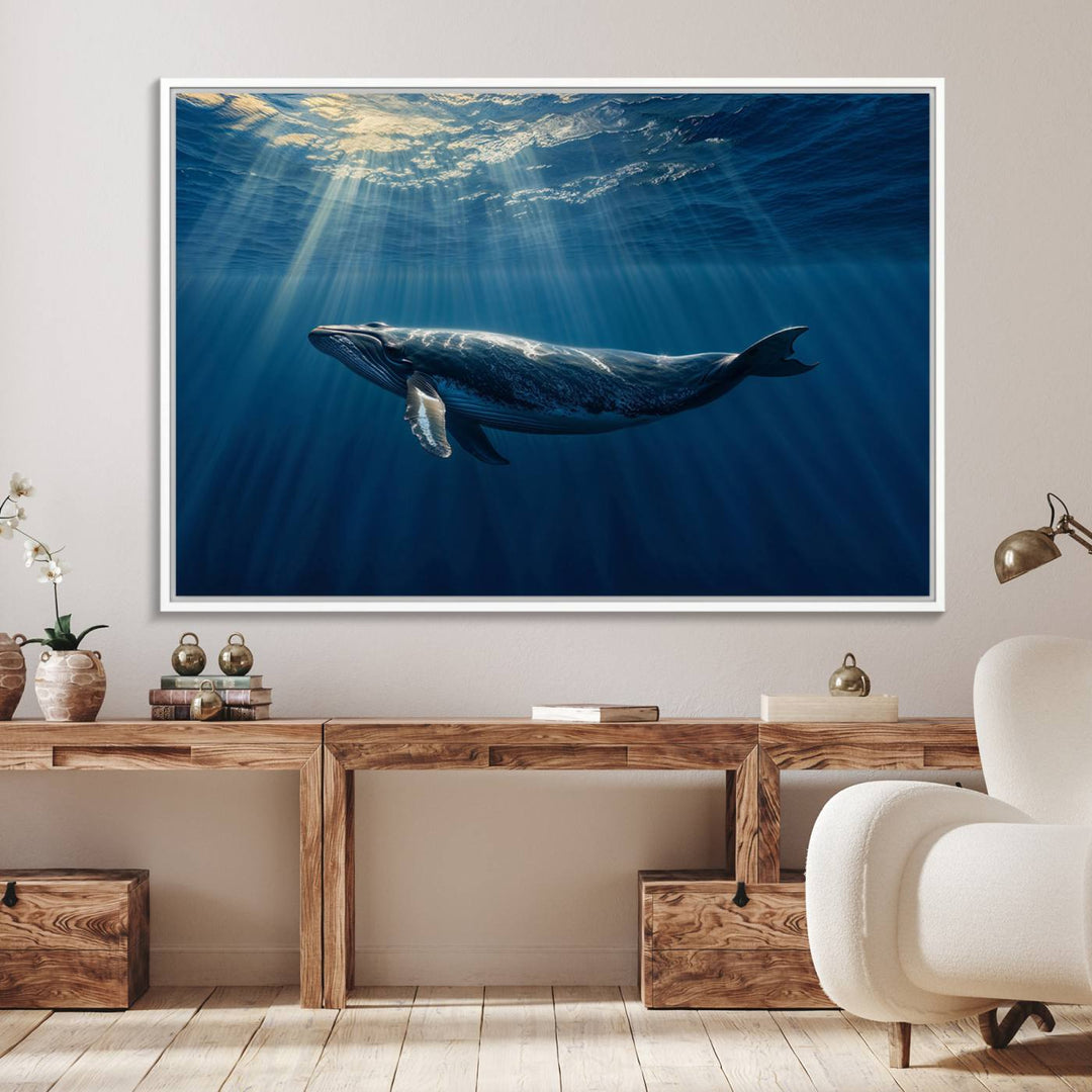 The Whale under Ocean wall art canvas print graces the white wall.