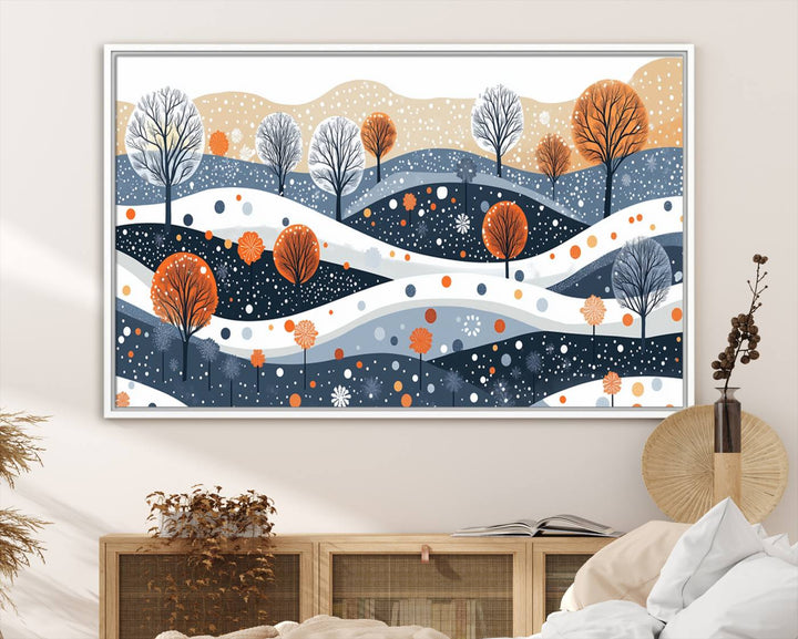 The "Abstract Winter Landscape Canvas Wall Art Print," featuring a triptych of landscapes with trees and hills in vibrant orange, white, and blue hues, adds a gallery-quality finish that transforms the space into an art lover's dream.