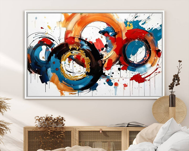 The Abstract Wall Art Rings Canvas Print, with its bold and colorful circular strokes, adorns the wall, epitomizing contemporary design.