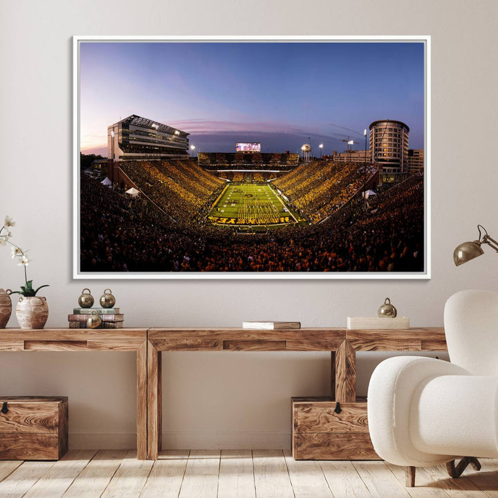 The Iowa Hawkeyes Kinnick Stadium Wall Art Canvas Print captures a sunset scene, making it perfect for display on a wall.