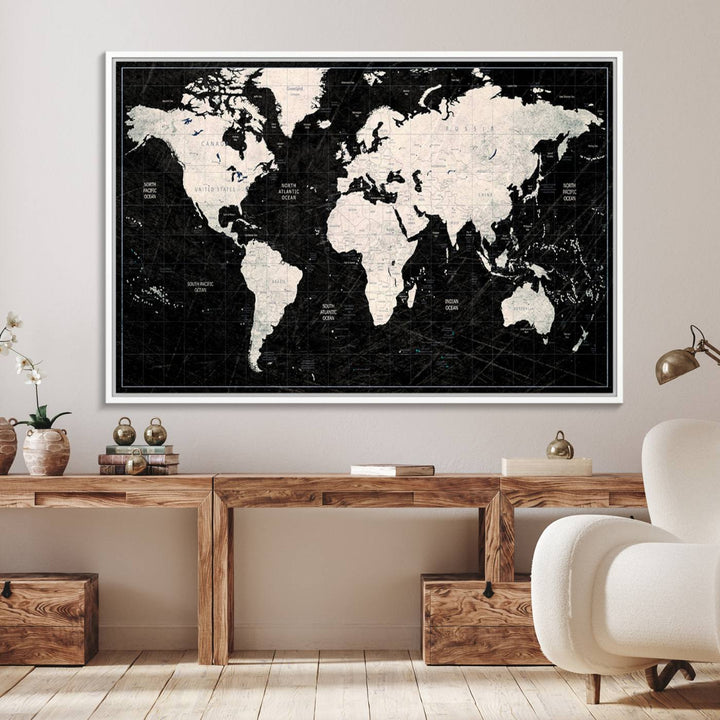 The Black & White World Map Canvas Wall Art, a giclee print, elegantly decorates the wall.