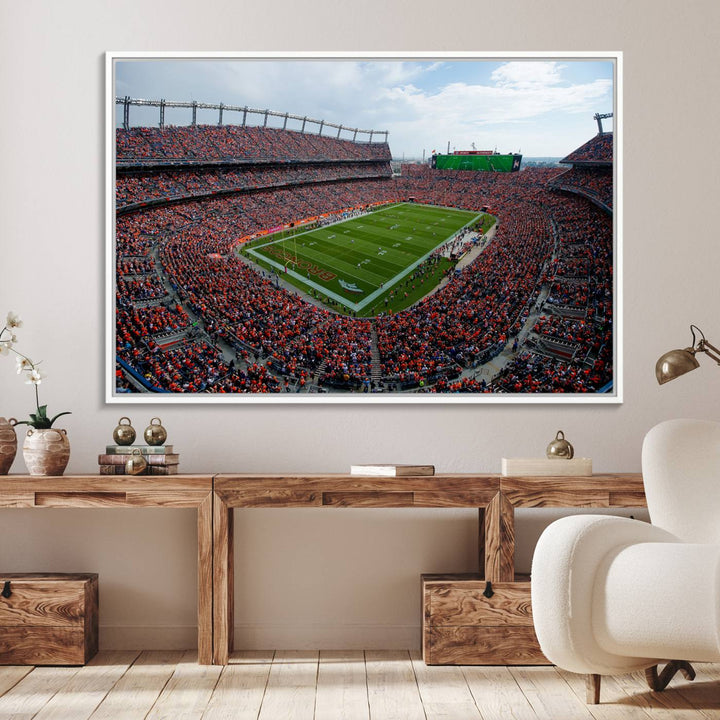 The Denver Broncos Football Print features a vibrant, fan-filled orange stadium overlooking the football field.